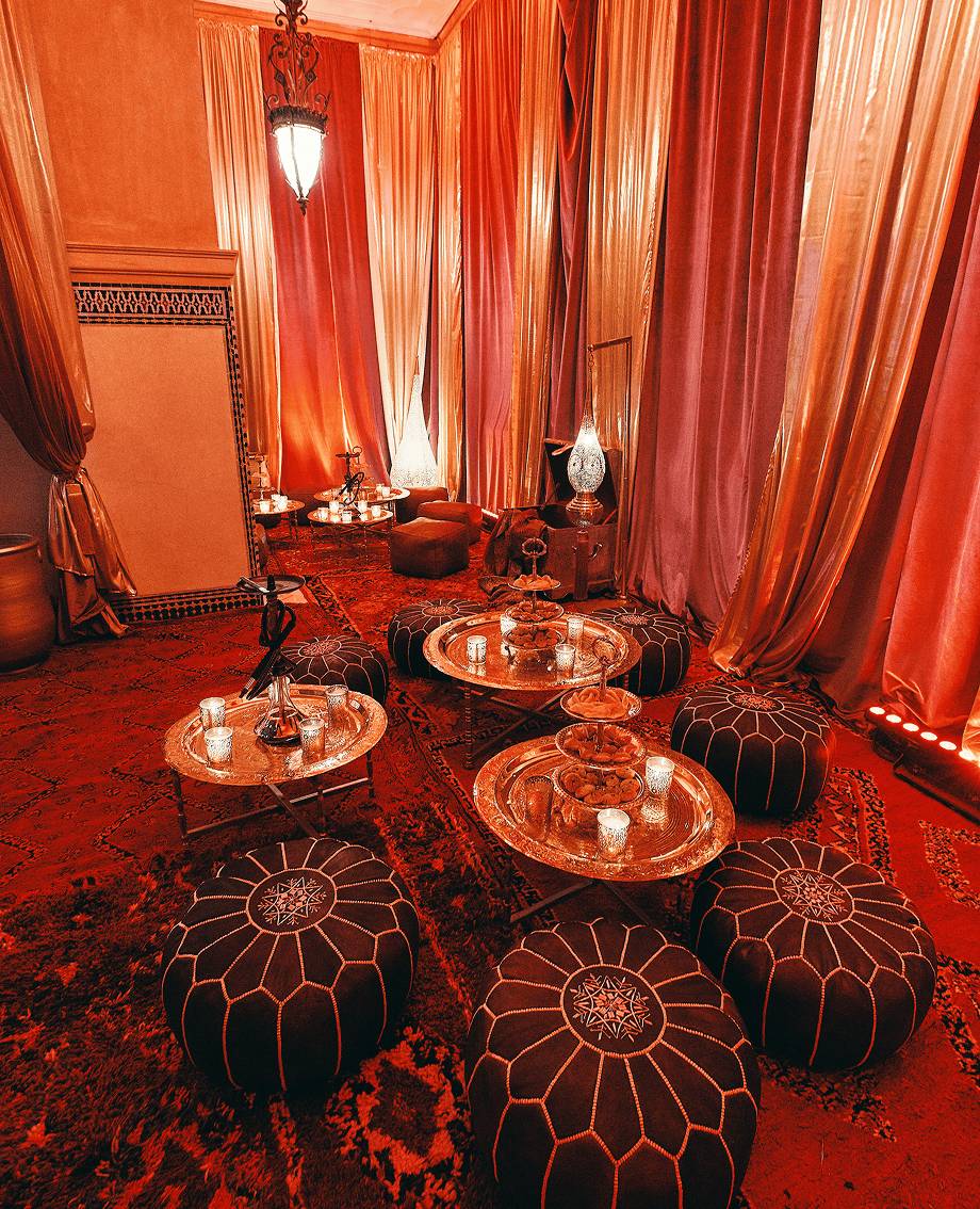 Sunlight shining through hanging white flowers and green leaves in an outdoor setting.