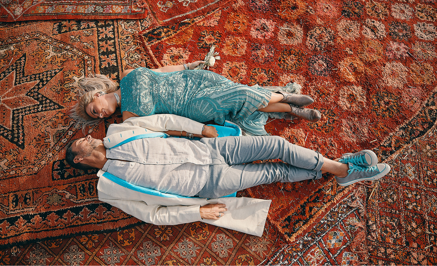 Sunlight shining through hanging white flowers and green leaves in an outdoor setting.