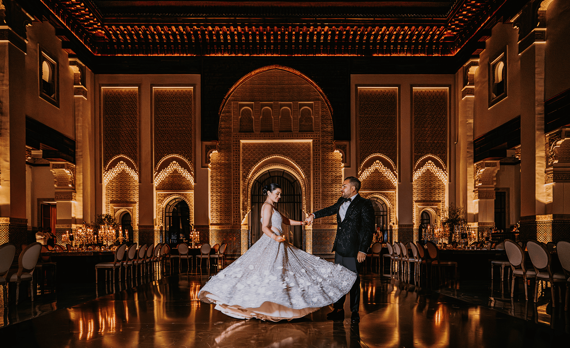 Sunlight shining through hanging white flowers and green leaves in an outdoor setting.