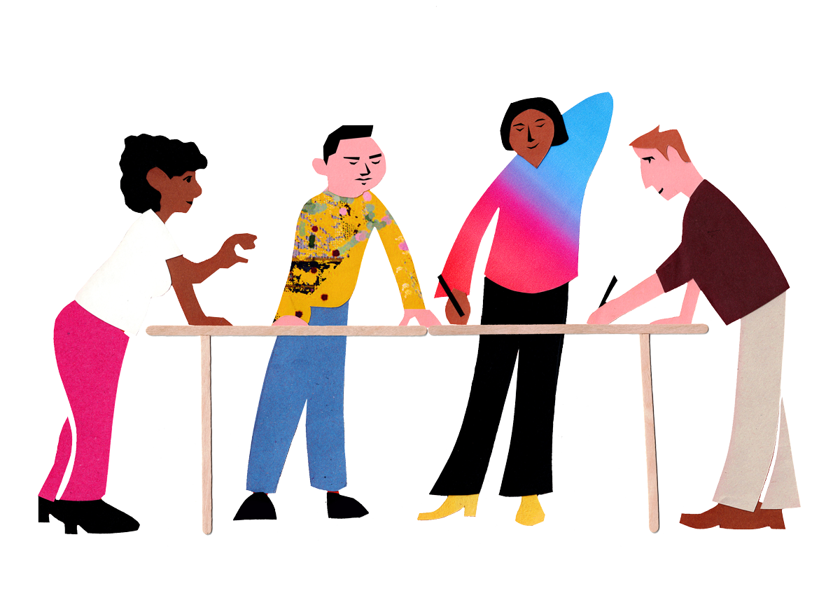 Four people are leaning over a table working or workshopping something, one is gesticulating, two hold pencils.