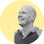 A yellow circle with a black and white photo portrait over the top