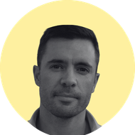 A yellow circle with a black and white photo portrait over the top