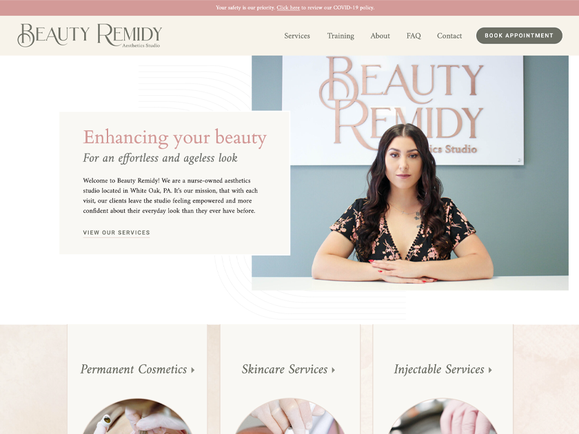Beauty Remidy Aesthetics Studio website homepage design with the owner seated in front of the studio logo and the headline "Enhancing your beauty"