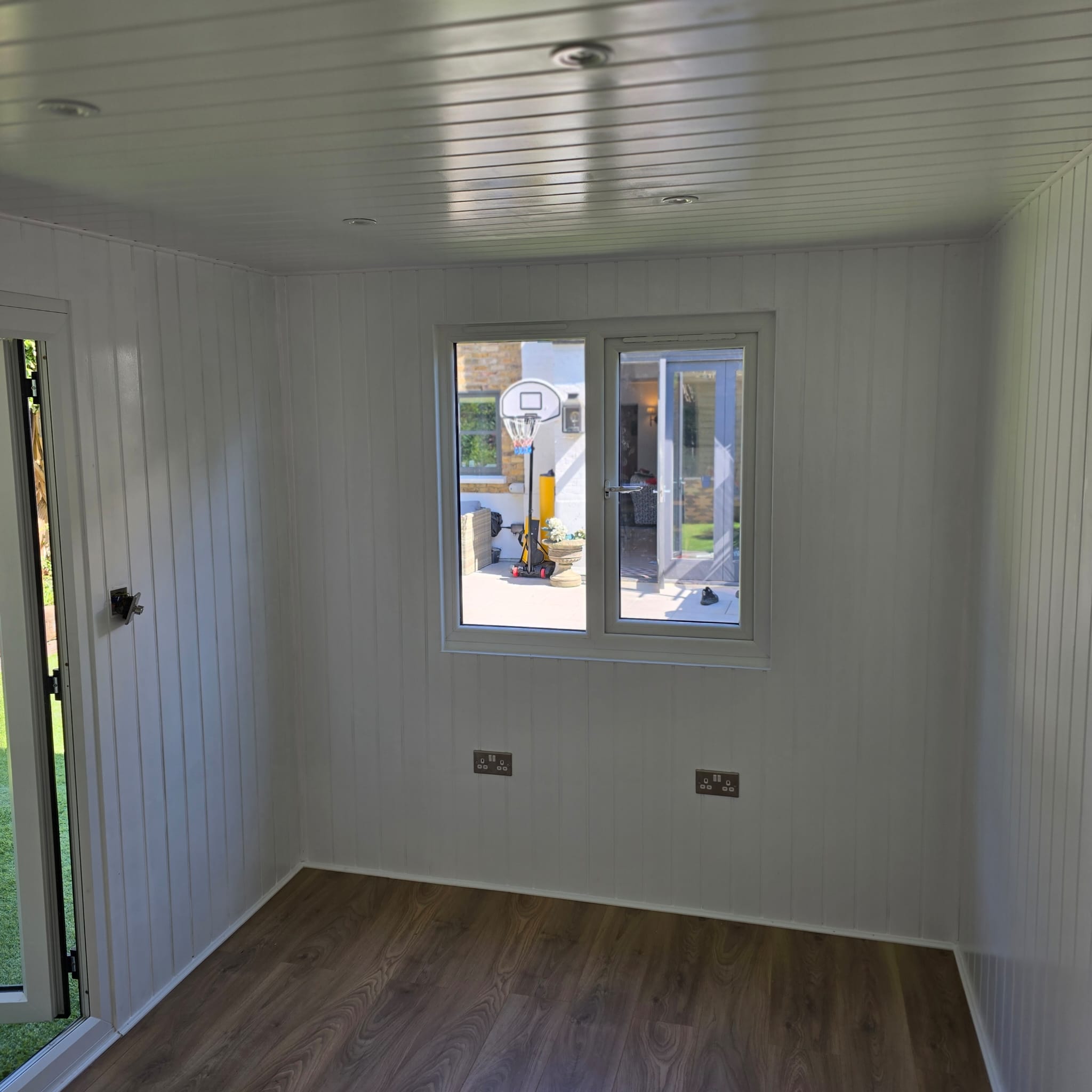 Interior and custom built garden office with laminate flooring in Earlsfield SW18 