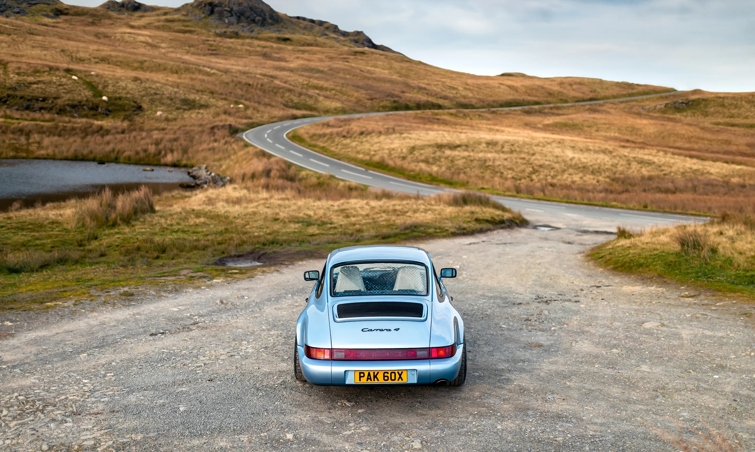 Porsche 964 Carrera 4 at a pull-off on the B4407 as the road winds away through Snowdonia