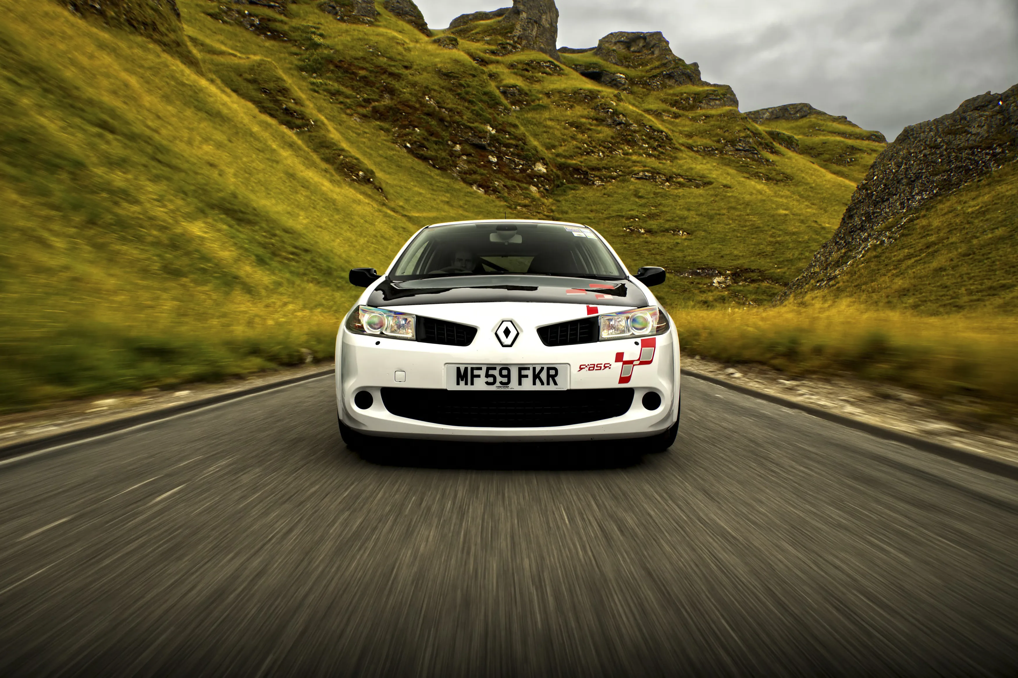 Renault Megane R26.R Review Rush Magazine - front tracking shot of the car driving through Winnat's Pass, Derbyshire