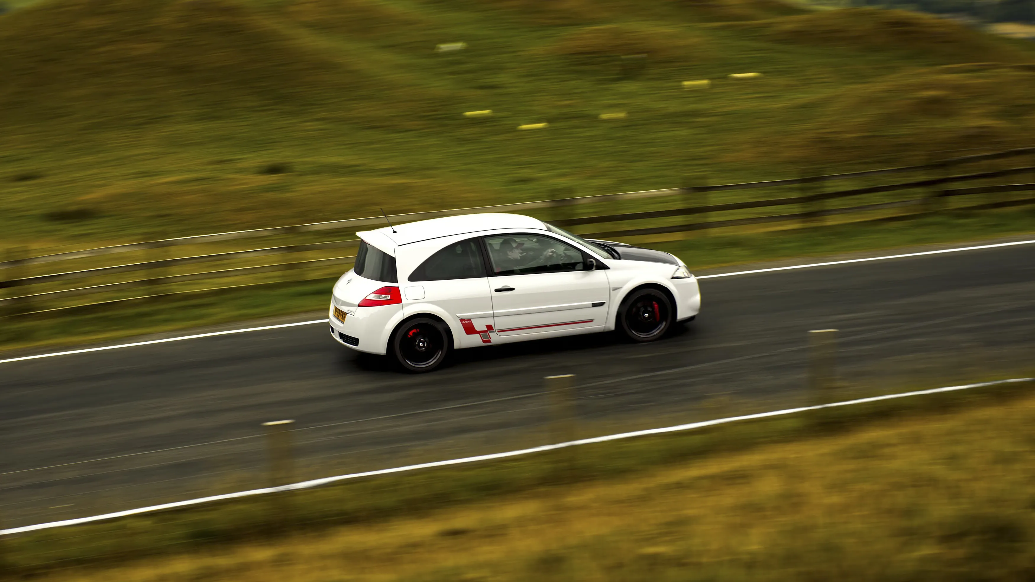 Renault Megane R26.R Review Rush Magazine - side panning shot of the car driving through Edale Valley, Derbyshire