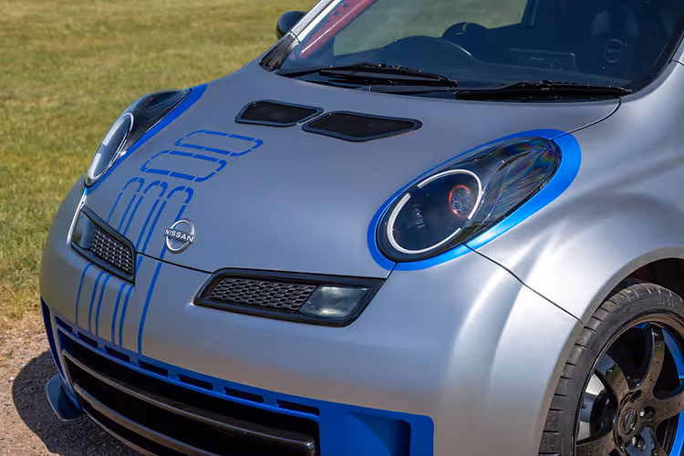 2025 Nissan Micra 350SR updated for its 23rd anniversary with satin silver wrap, blue accents, and refreshed detailing by Nissan Design Europe.