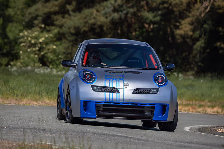 In action on track: 2025 Nissan Micra 350SR updated for its 23rd anniversary with satin silver wrap, blue accents, and refreshed detailing by Nissan Design Europe.