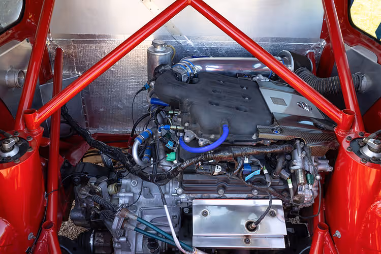 Engine bay - 2025 Nissan Micra 350SR updated for its 23rd anniversary with satin silver wrap, blue accents, and refreshed detailing by Nissan Design Europe.