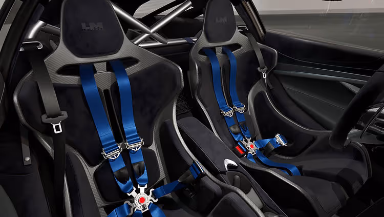 Interior of the McLaren 750S Le Mans Edition featuring Carbon Black Alcantara with Dove Grey accents and bespoke Le Mans branding on the headrests.