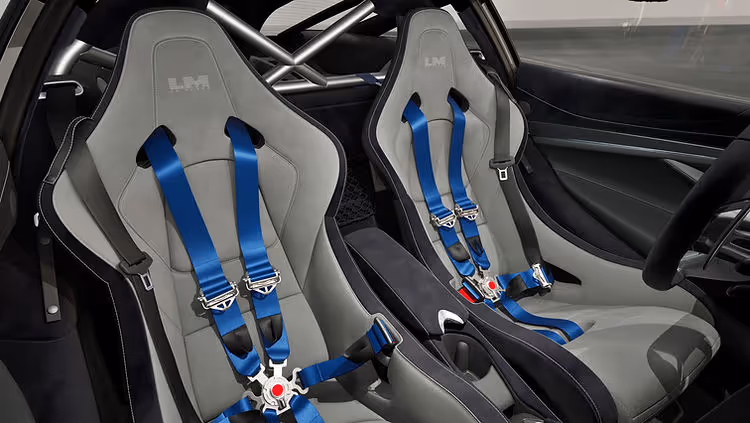 Interior of the McLaren 750S Le Mans Edition featuring Carbon Black Alcantara with Dove Grey accents and bespoke Le Mans branding on the headrests.