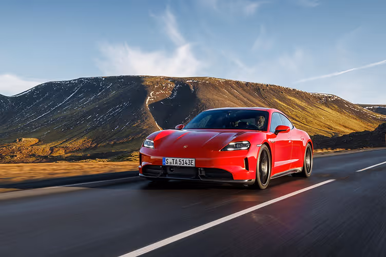 Porsche Taycan GTS tracking shot carmine red
