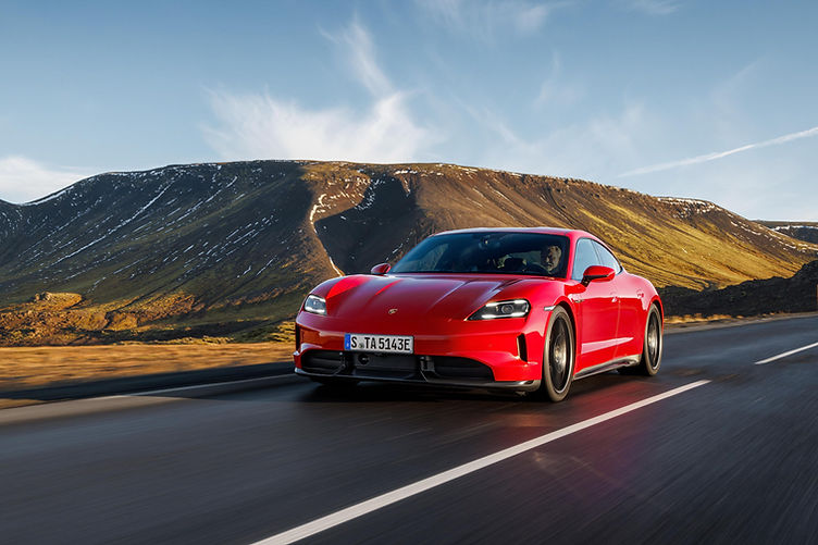 Porsche Taycan GTS tracking shot carmine red