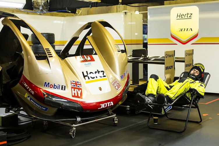 A Hertz Team Jota mechanic catches a nap