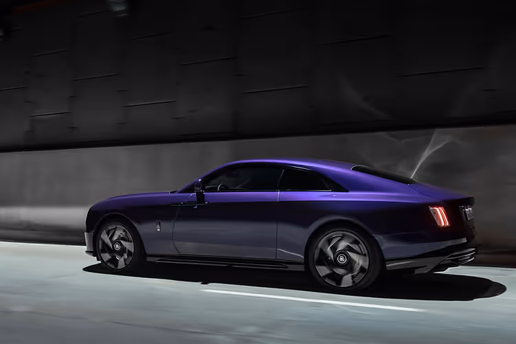 2025 Rolls-Royce Spectre Black Badge driving rear