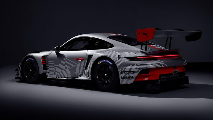 Rear three quarter static profile image of Porsche 911 GT3 R (Model Year 2026), 2025, Porsche AG shot in a dark grey studio