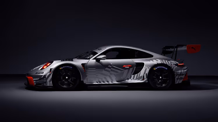 Side profile studio image of silver and red Porsche 911 GT3 R (Model Year 2026), 2025, Porsche AG