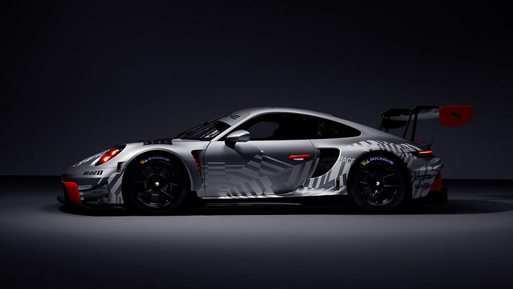 Side profile studio image of silver and red Porsche 911 GT3 R (Model Year 2026), 2025, Porsche AG