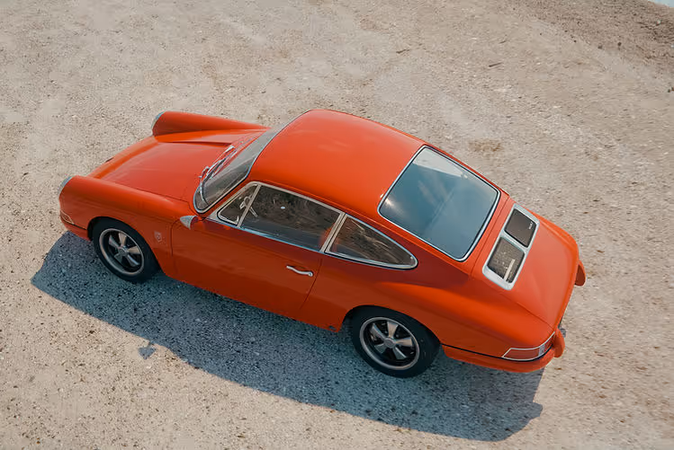KAMM Launches More Refined 912T - high angle view of orange coupe