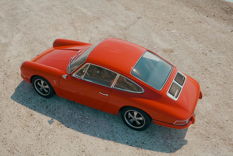 KAMM Launches More Refined 912T - high angle view of orange coupe