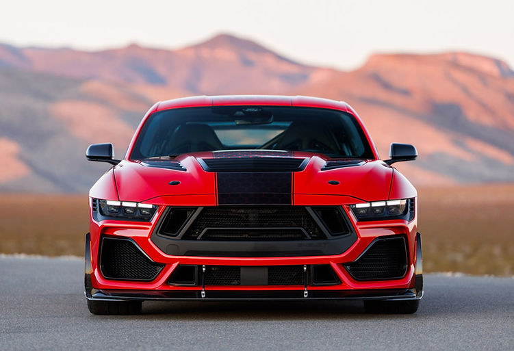 Front view of the Shelby Super Snake-R highlighting the aggressive grille, carbon bonnet vent, front splitter and wide stance, set against a desert mountain backdrop.