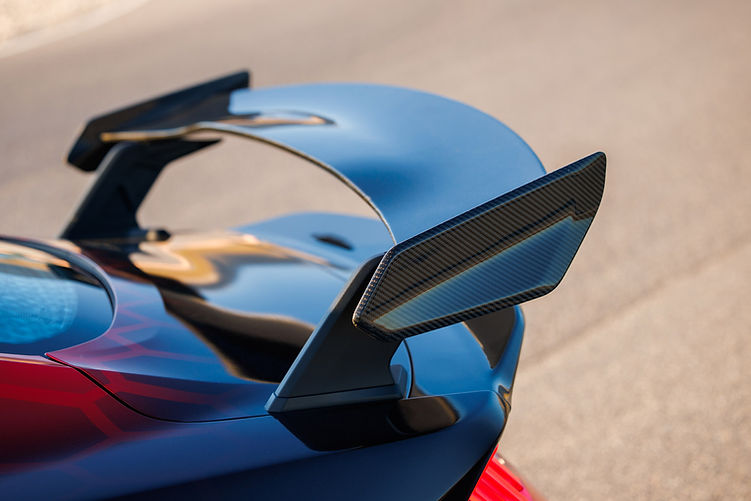 Close-up of the Shelby Super Snake-R’s carbon fibre pedestal rear wing, highlighting its sculpted endplates and track-focused aerodynamic design.