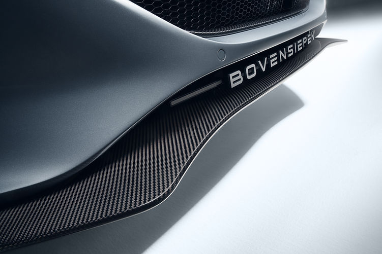 Close-up of the Bovensiepen Zagato Carbon Package front end with high-gloss carbon splitter and stainless steel grille surround.