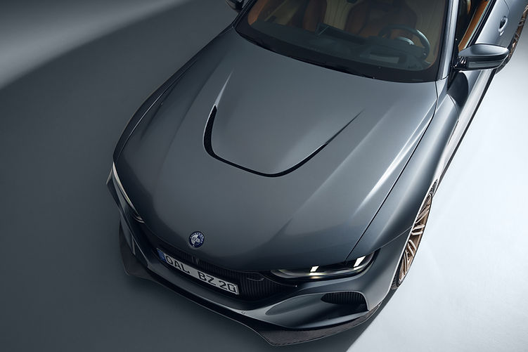 Close-up of the Bovensiepen Zagato Carbon Package front end with high-gloss carbon splitter and stainless steel grille surround.