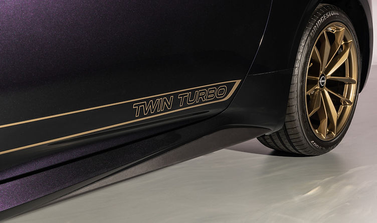 The 2026 Nissan Z Heritage Edition recreates retro styling with bronze “Twin Turbo” graphics on the body sides.