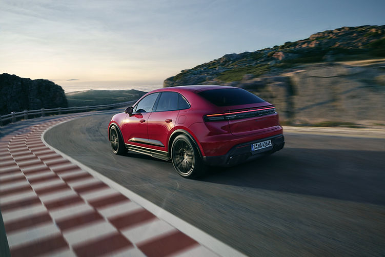 2026 Porsche Macan GTS Electric - driving rear quarter