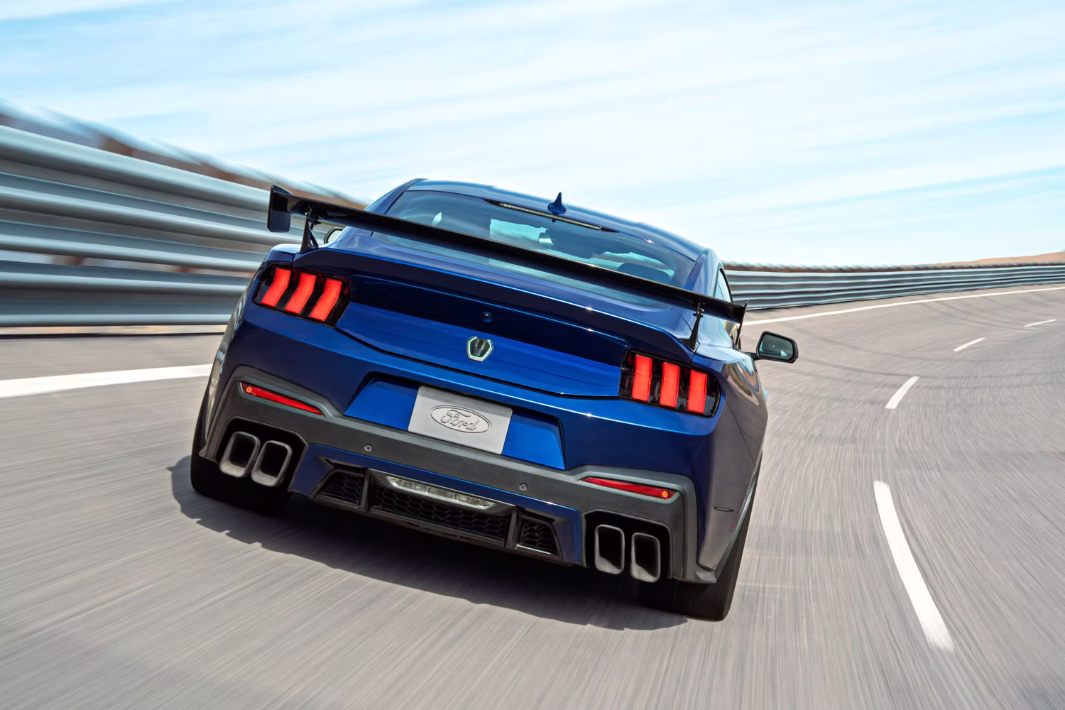 2026 Ford Mustang Dark Horse SC Track Pack in blue rear tracking shot at speed