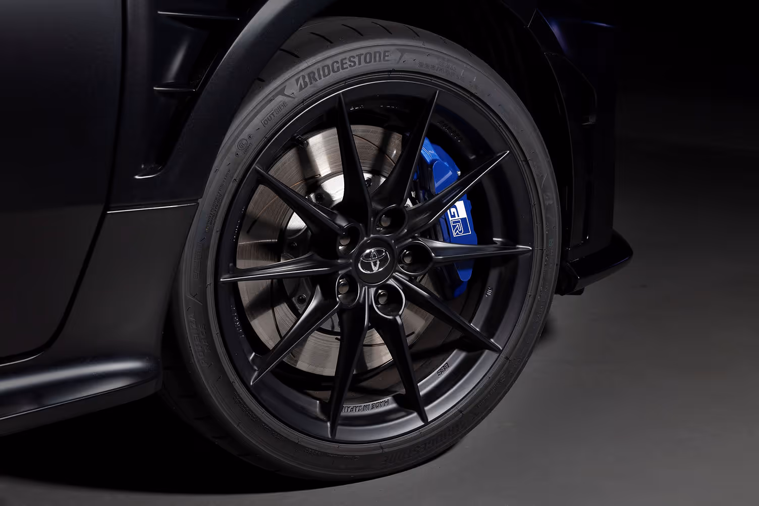 Matte black forged magnesium wheel with Ogier signature blue brake calliper