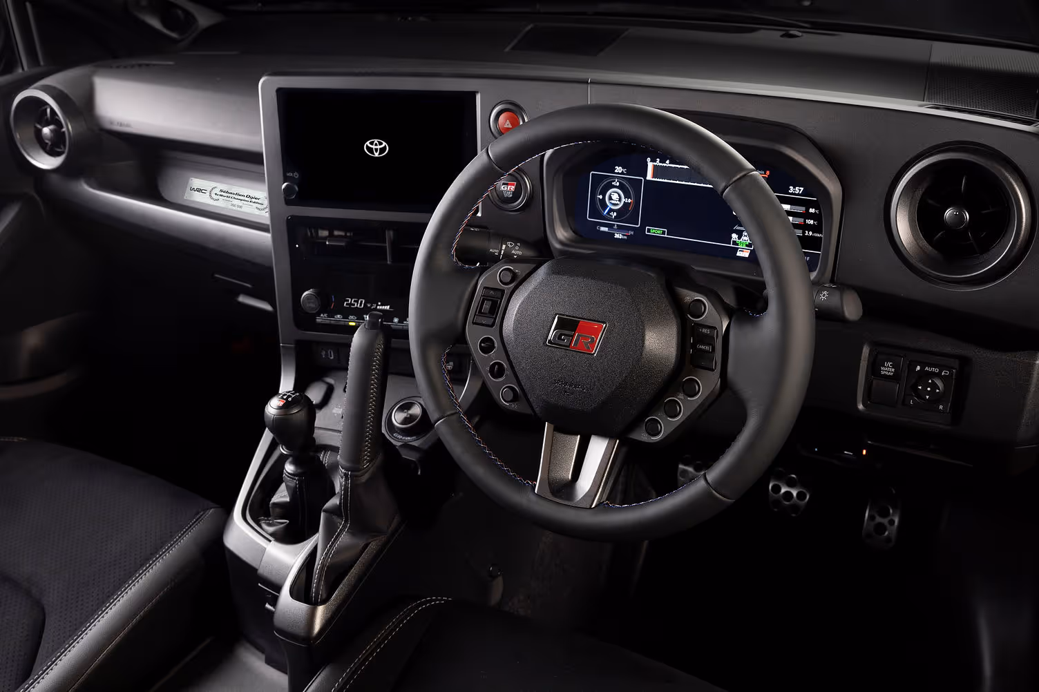GR Yaris Ogier 9x interior with Rally2-derived steering wheel and vertical handbrake