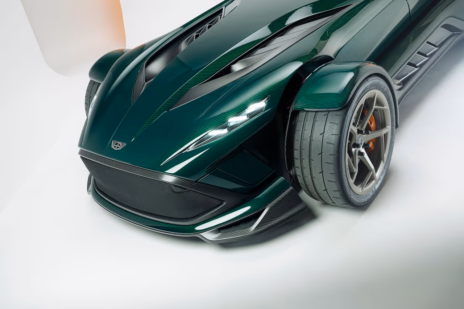 Donkervoort P24 RS front three-quarter view showing optional front wing elements and swing-out headlights