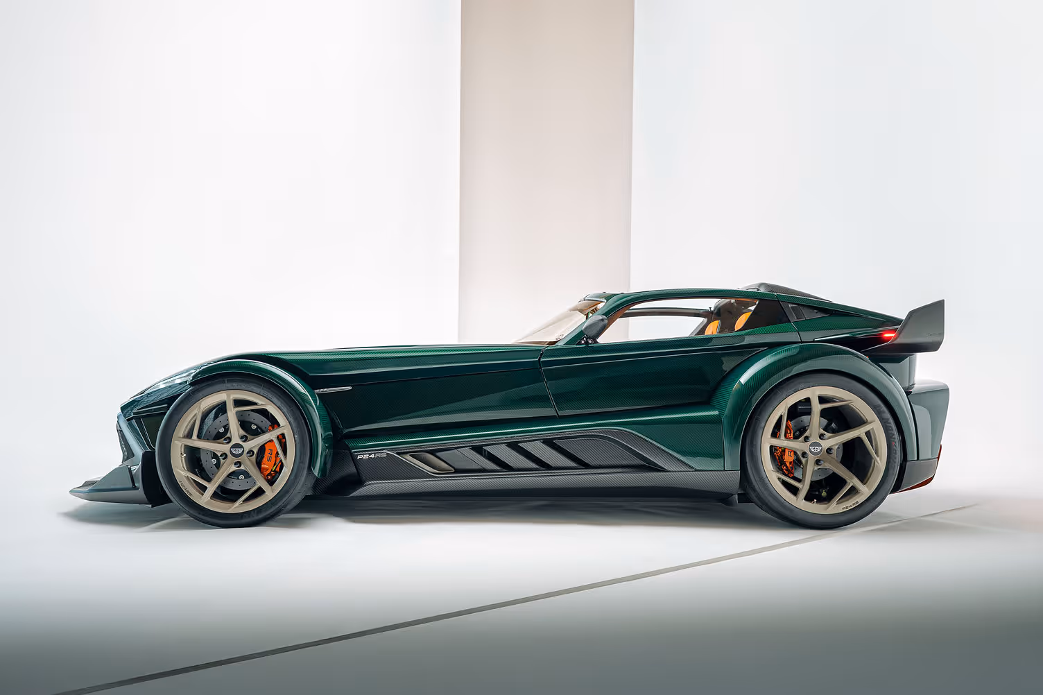 Donkervoort P24 RS side profile in green with optional aero kit and cream alloy wheels