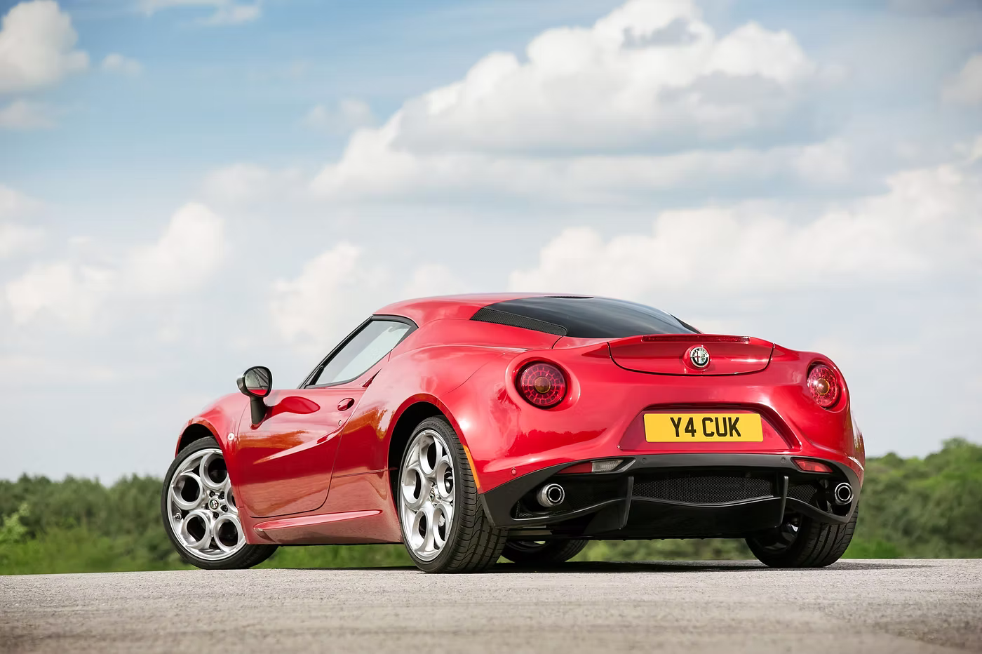 Rear three quarter static shot of a red Alfa Romeo 4C - Rush magazine buyer's guide