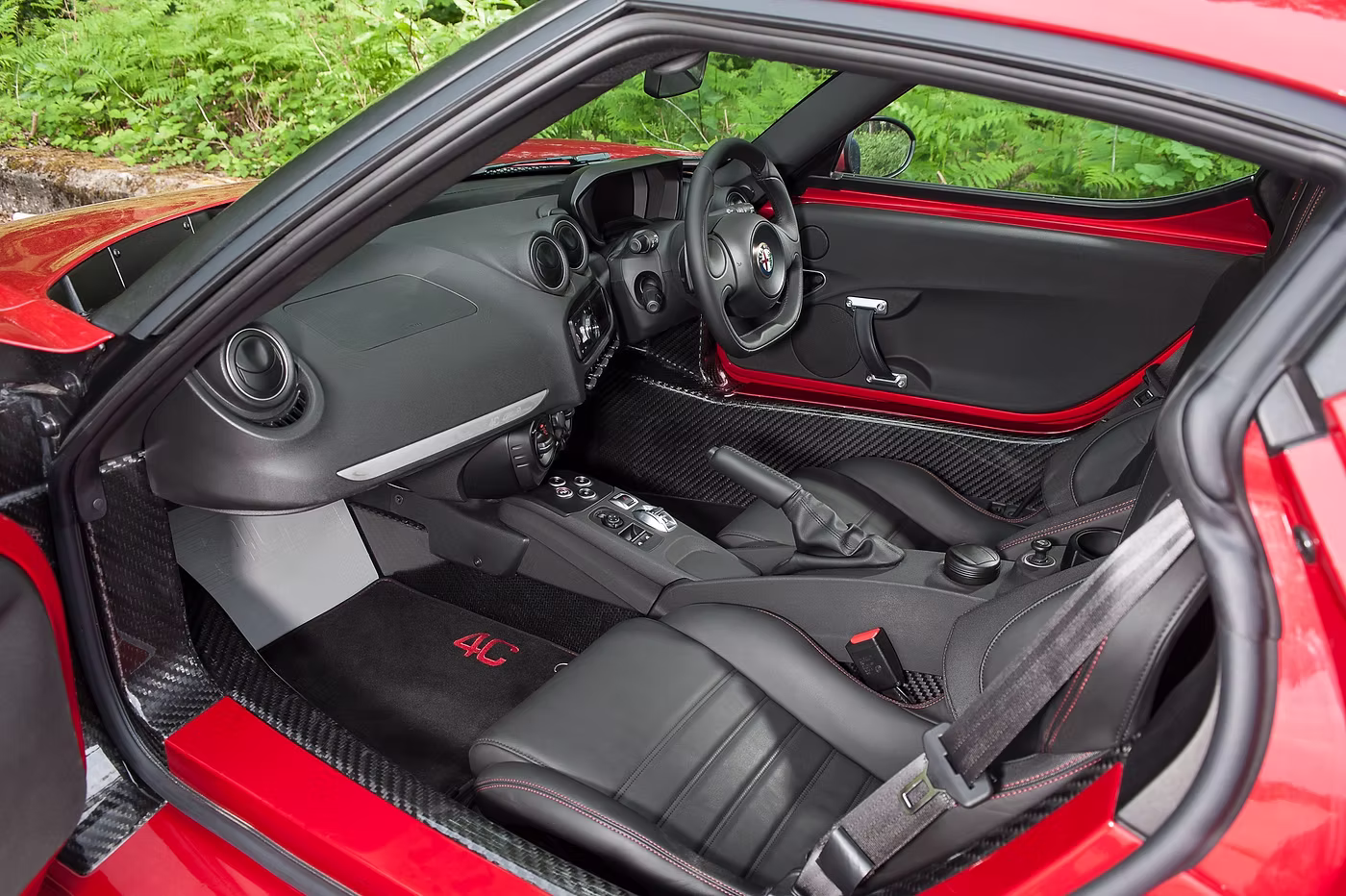 Interior shot of a red Alfa Romeo 4C - Rush magazine buyer's guide