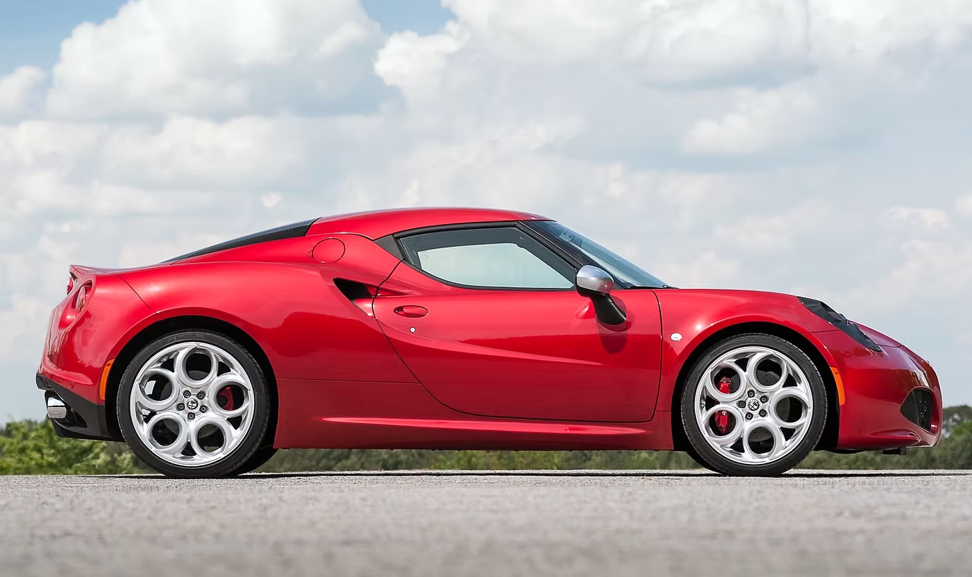 Side profile shot of a red Alfa Romeo 4C - Rush magazine buyer's guide