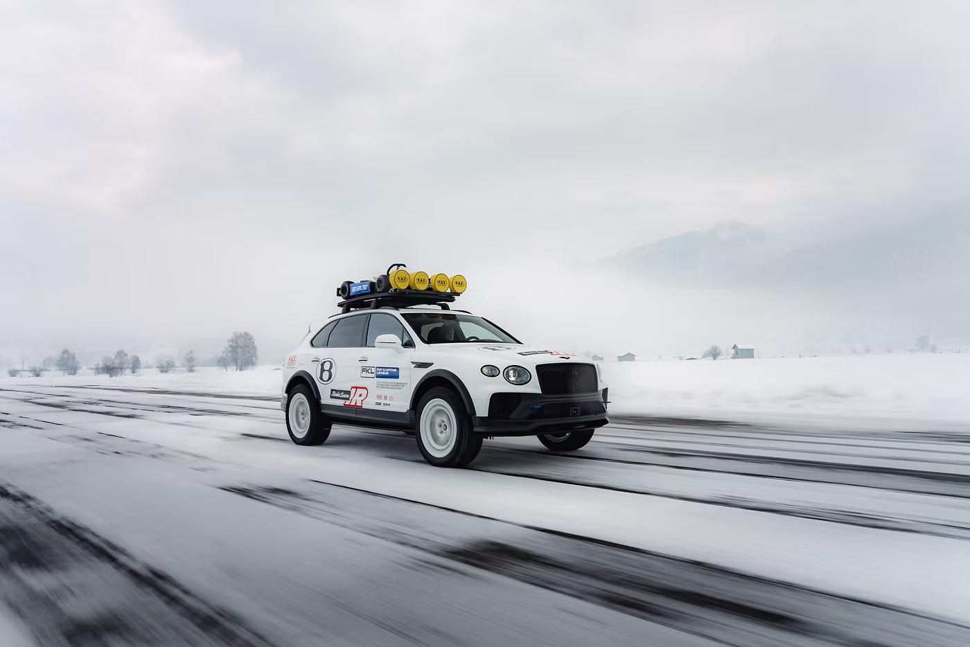 Bentayga X Concept front three quarter tracking image against a snowy backdrop