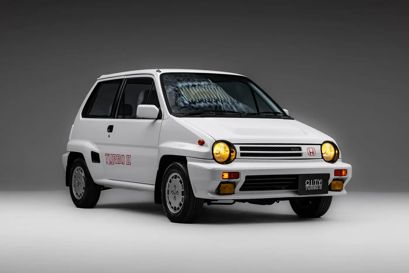 1980s Honda City Turbo II in white, front three quarter view, studio setting