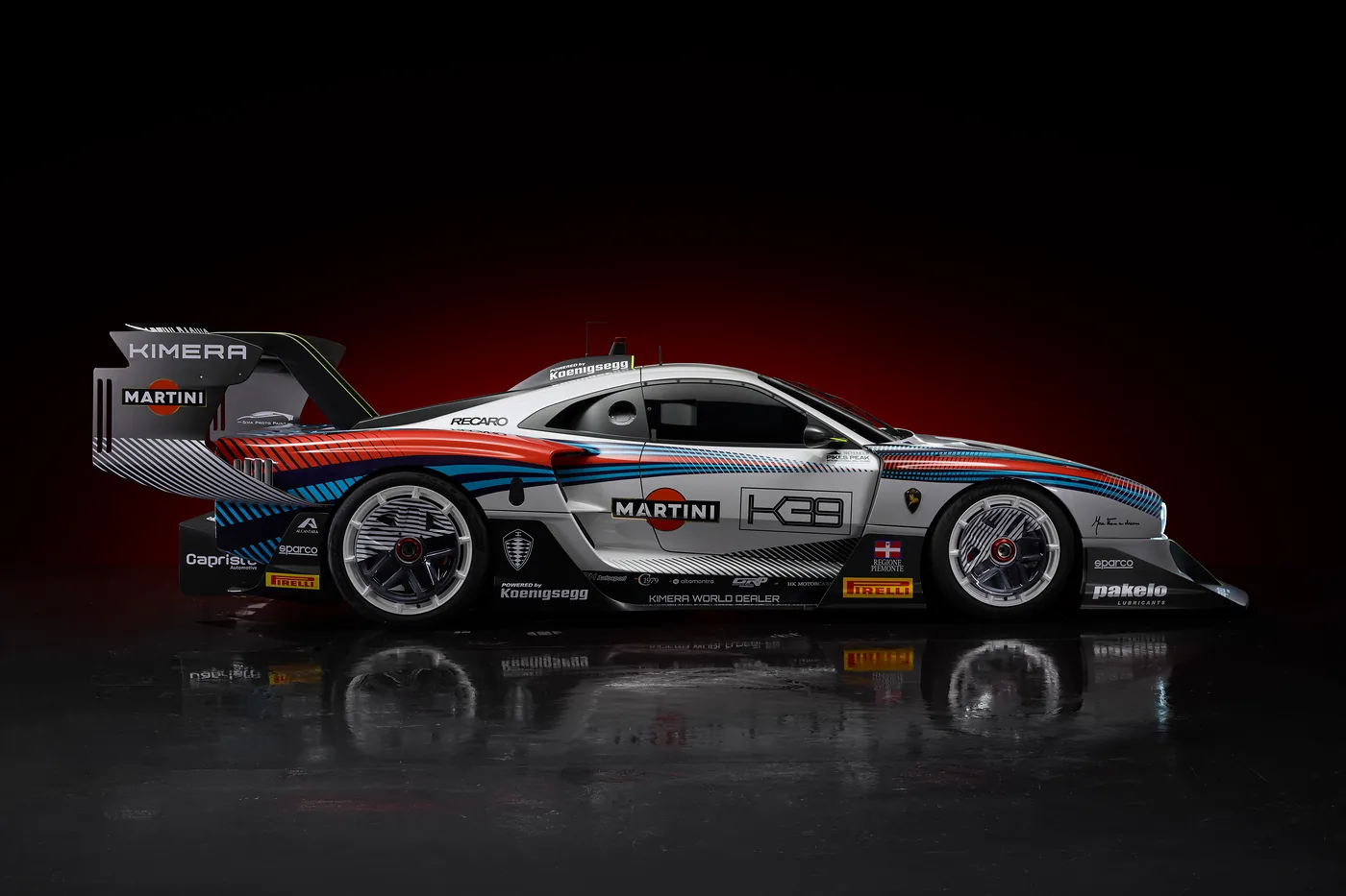 Side profile studio shot of Kimera K-39 Pikes Peak configuration and Martini Racing livery