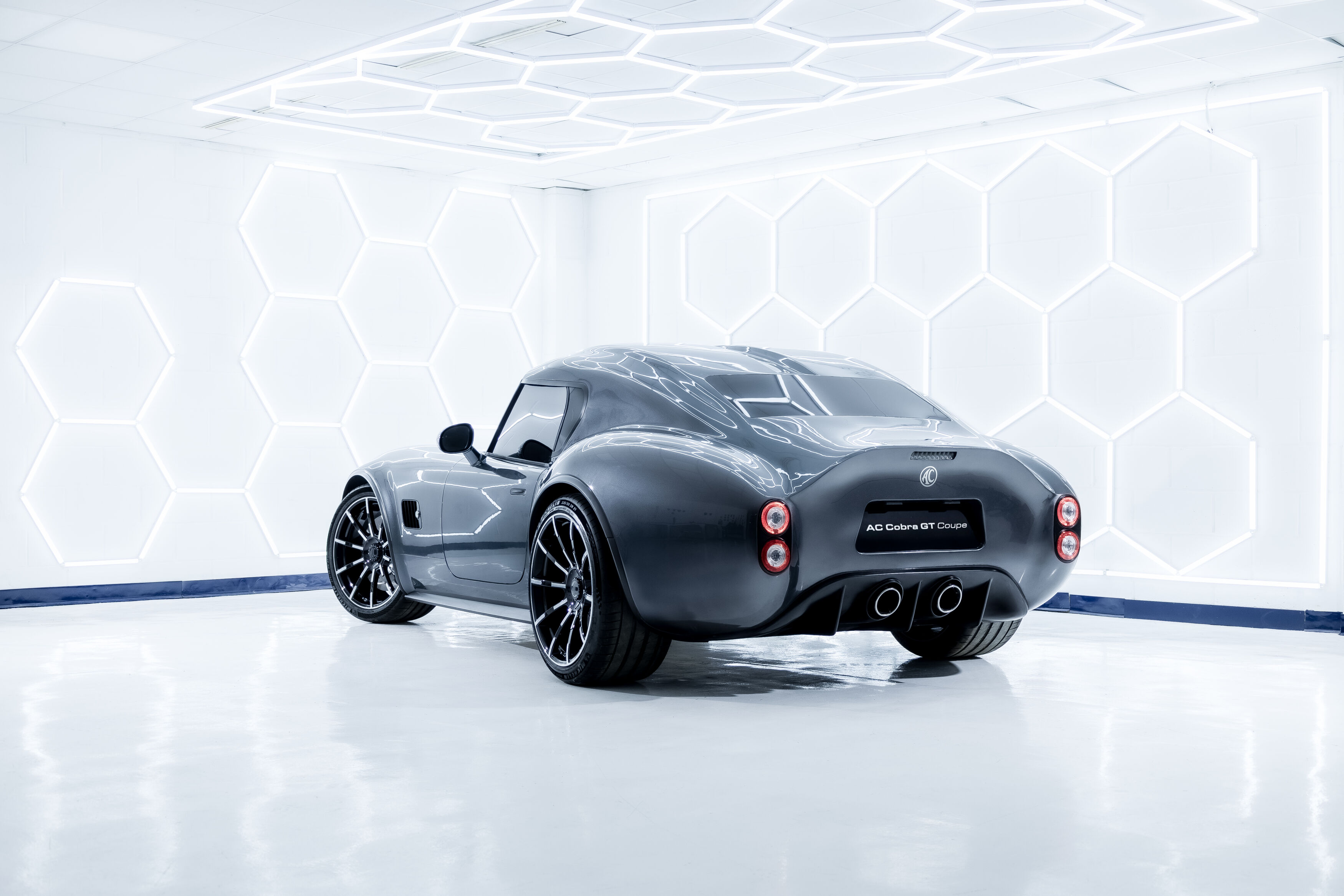AC Cobra GT Coupe rear three quarter studio