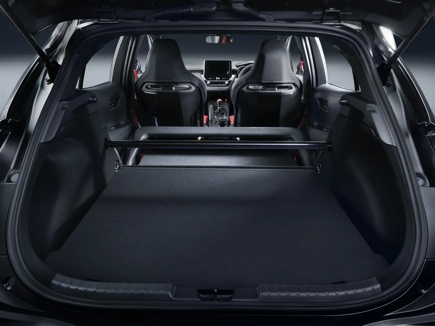 Toyota GRMN Corolla two-seat cabin viewed from boot, showing structural brace where rear seats were removed