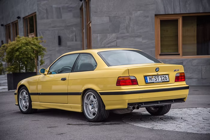 E36 M3 3.0 Dakar Yellow rear three quarter no spoiler