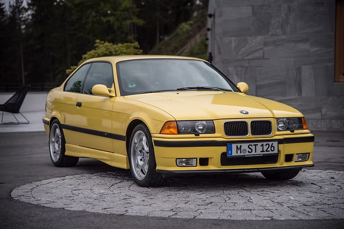 E36 M3 3.0 Dakar Yellow front three quarter with ambers