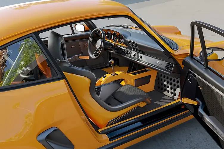 Singer's latest reimagined 911 blends wide-body '80s looks with a 4.0L VVT flat-six, hybrid cooling, and F1-grade chassis tech from Red Bull. Interior shot
