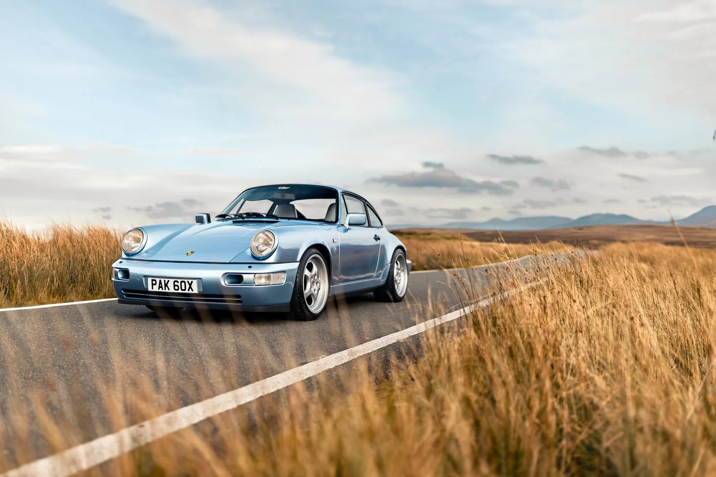 Porsche 964 Carrera 4 on the B4407, an open moorland road across Eryri in North Wales