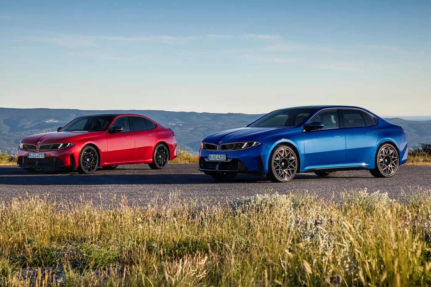 Fire Vegas Red BMW M350 xDrive alongside a blue BMW i3, the petrol and electric 3 Series together