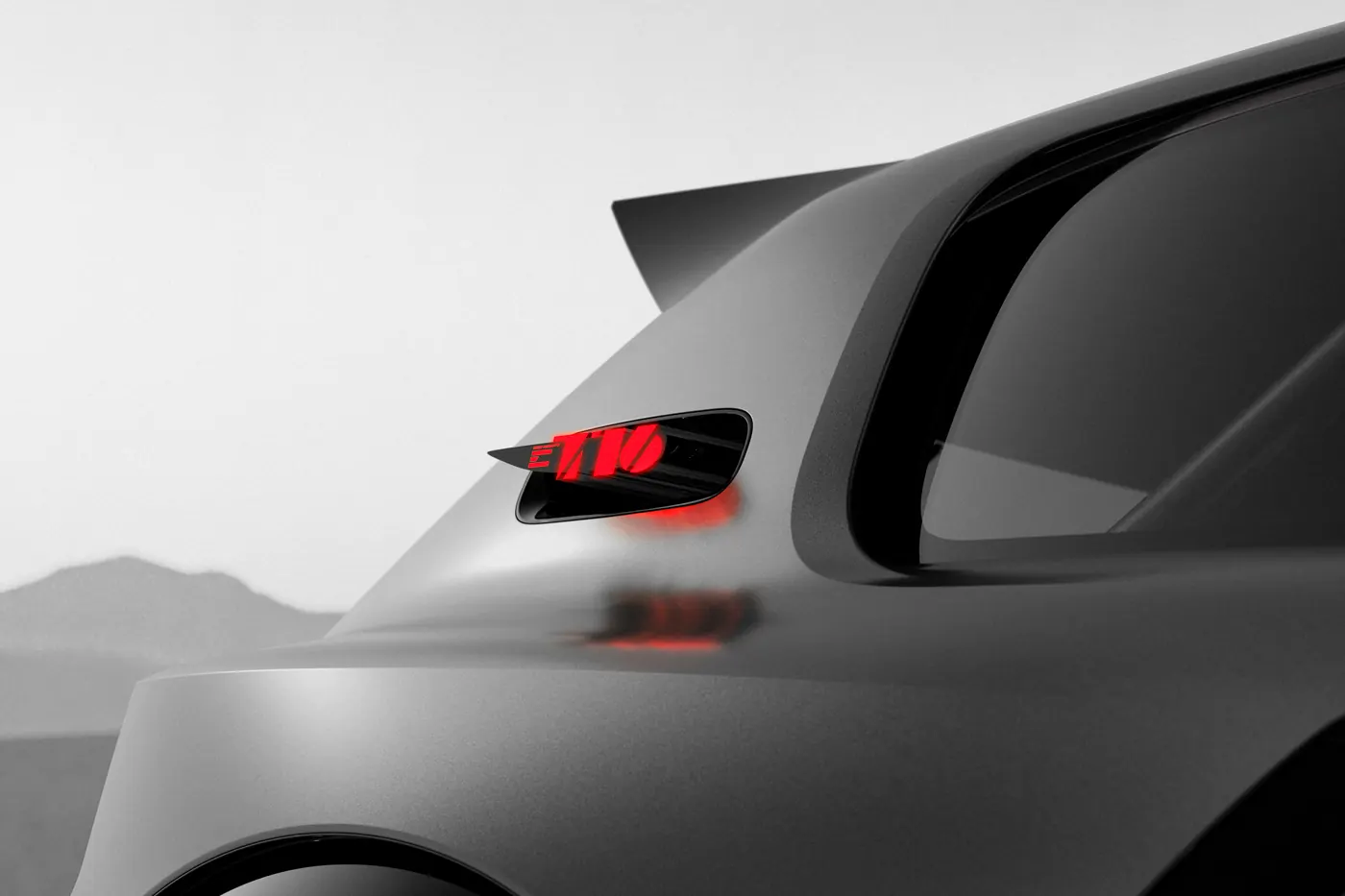 Close-up of the illuminated E-T16 badge on the Peugeot concept's floating C-pillar.